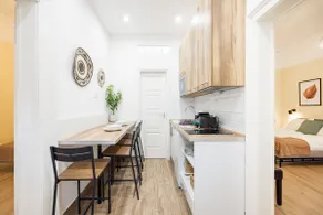 Compact two-bedroom retreat with AC & free parking - Image 3