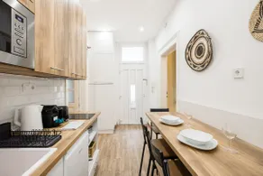 Compact two-bedroom retreat with AC & free parking - Image 4