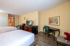 Hotel room with two beds at Domaine Saint-Sauveur - Image 5