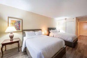 Hotel room with two beds at Domaine Saint-Sauveur - Image 3
