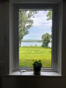 Riverside Apartment with Sunset View from Bed - Image 5