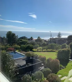 Modern house with ocean views and a large garden. - Image 3
