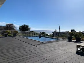 Modern house with ocean views and a large garden. - Image 4