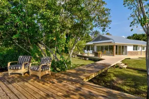 NO ADDED AirBnB FEES! Exotic Water Front Sleeps 14 - Image 5