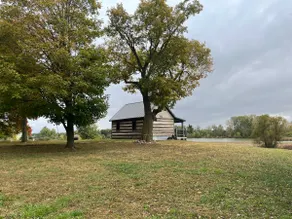 Cabin overlooking wetland area. - Image 3
