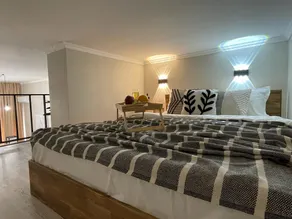 Loft-style studio on two levels in the city center - Image 4