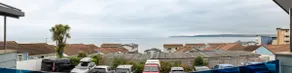 Seaside 3BD Retreat with Balcony & Stunning Views - Image 4