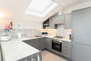 Seaside 3BD Retreat with Balcony & Stunning Views - Image 3