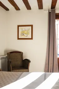 A room with a kitchen. - Image 2