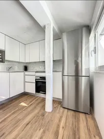Chic Penthouse with Urban Charm & Rooftop - Image 4