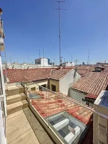 Chic Penthouse with Urban Charm & Rooftop - Image 2
