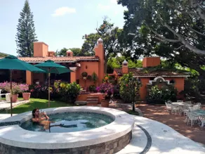 A villa with a swimming pool, jacuzzi, tennis court, and squash - Image 3