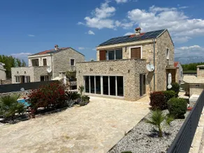Stone house villa with an electric vehicle charging station - Image 2