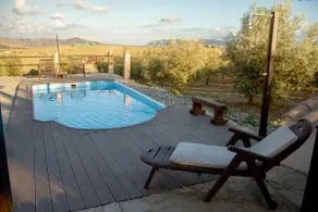 A rural house with a swimming pool and surrounded by nature - Image 2