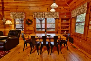 Cozy log cabin with hot tub and view of the forest - Image 4