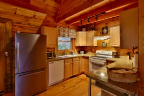 Cozy log cabin with hot tub and view of the forest - Image 5
