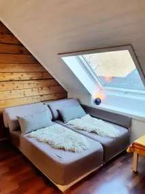 Central loft apartment with timber wall and wood burning stove. - Image 4