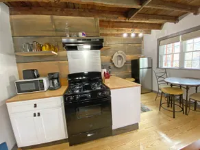 Cozy 2BR with Rustic Decor Near Downtown - Image 5