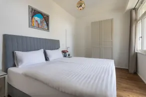 Dwellfort | Luxury Apartment with Balcony and View - Image 4