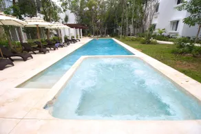 Bright Modern 2BR at TAO | Pools, Gym, Fast WiFi - Image 3