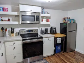 Lovely basement apartment with covered outdoor patio. - Image 2