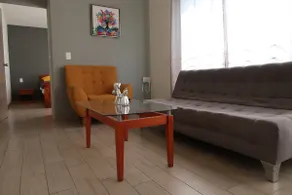 Minimalist Apartment with a Relaxing Rooftop Patio - Image 3