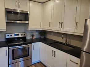 Bright MCM 2 Bedroom Walk Up with Private Deck/BBQ - Image 3