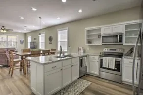 Riverfront getaway with steps to fishing paradise. - Image 5