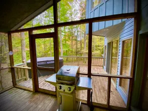 Cozy two bedroom cabin with a hot tub. - Image 5