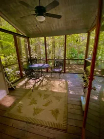 Cozy two bedroom cabin with a hot tub. - Image 4