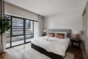 Spacious Inner-city Stay with King Bed and Balcony - Image 5