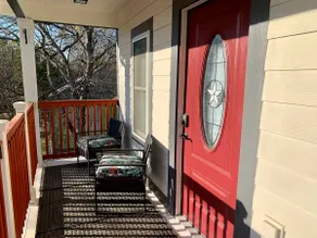 Guest house with private driveway and fence. - Image 2