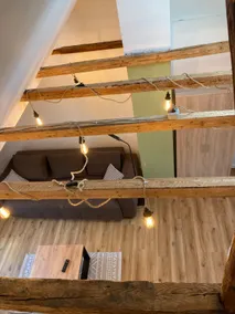 Renovated apartment above the rooftops of the city - Image 4
