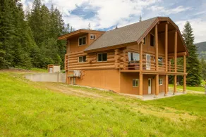 The Cabin · Rustic Log Cabin with Pasture and Mountain Views - Image 2