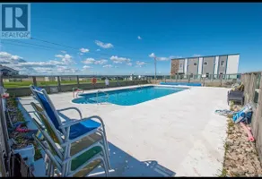 Lovely waterfront 2 bedroom condo with pool - Image 4
