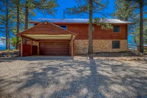 4-bedroom nestled in the trees with views! - Image 4