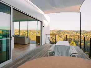 A modern light-filled home with views of the woods - Image 2