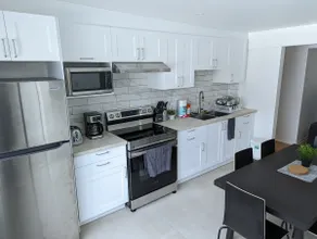 LOVELY 2 BEDROOM CONDO with FREE PARKING! - Image 2
