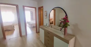 A bright apartment in a residential development with a swimming pool - Image 4
