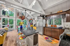 Whimsical cabin — 4 acres with hot tub, fire pit, spacious screened porch & pond - Image 5