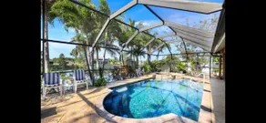 Sanctuary w/covered heated saltwater pool on canal - Image 2