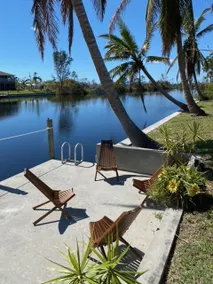 Sanctuary w/covered heated saltwater pool on canal - Image 5