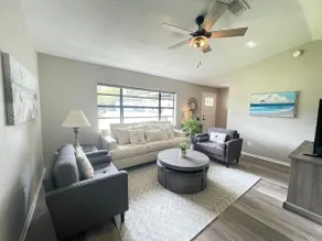 Stunning home with screened patio & fenced yard - Image 4