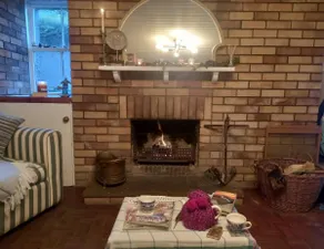 One bedroom, indoor fireplace. Right beside beach. - Image 3