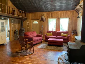 Cozy cabin nestled in the woods. - Image 2