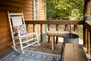 Cozy cabin nestled in the woods. - Image 4