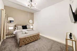 Stylish 2BR Luxury Retreat with 65" Smart TV - Image 5