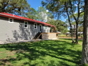 Adorable Red Roof Cottage nestled in treed acreage - Image 4