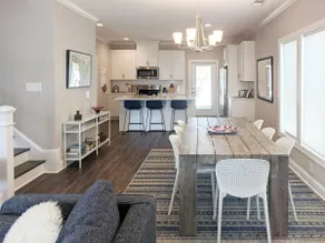 Enjoy sea breezes from double-decker porch -  walk to pool, private waterfront. - Image 5