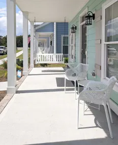Enjoy sea breezes from double-decker porch -  walk to pool, private waterfront. - Image 3